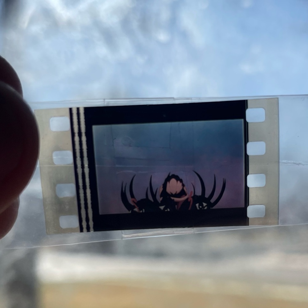 Film Strip with Dark Silhouette Design